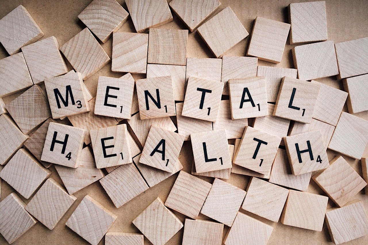 the word mental health spelled out on wooden tiles